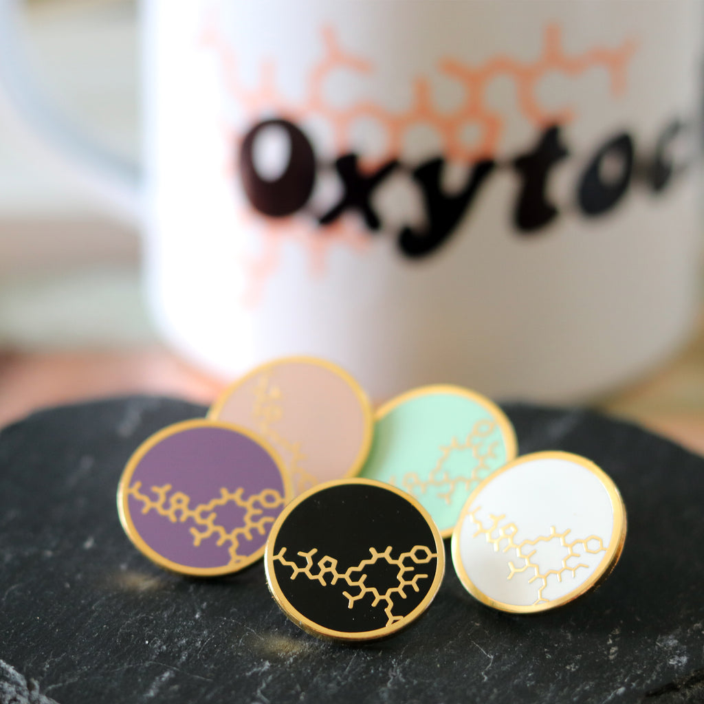 Oxytocin enamel pins by milk and moon
